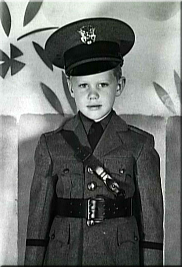 Larry as a child in uniform