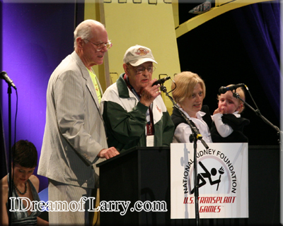 Larry Hagman with the oldest and youngest athletes